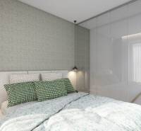 Bedroom of a holiday apartment with a comfortable bed, patterned pillows, and hanging lamps.