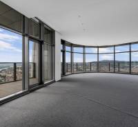 Spacious living room with glass walls and a view within a 4-room apartment.