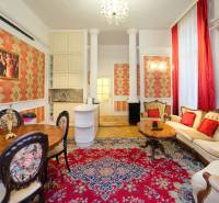 Luxurious interior with wood-decor flooring, an oriental rug, and elegant furniture in a 2-room apartment.