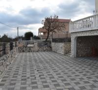 A family house in Pridraga with a stone courtyard and a view of the surrounding nature.
