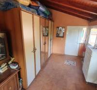 Interior with cabinets and a dresser, floor with wood decor in a family house.