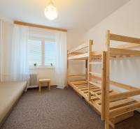 A children's room with a bunk bed and simple furnishings in a 3-room apartment.