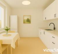 White kitchen in a 3-room apartment with wood-patterned flooring and a table.