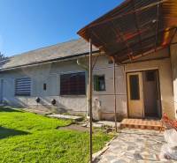A family house in Čebovce with a veranda and a well-maintained grassy garden.
