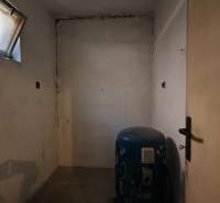 Empty room with a window and a tank in a family house.