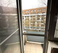 4-room apartment with a balcony and a view of the neighboring building.