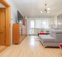 Living room in a 3-room apartment with a comfortable sofa and a wooden decor floor.