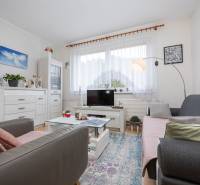 Living room in a 3-room apartment with comfortable seating and decorations.