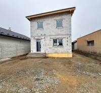 Unfinished family house on Hviezdna Street in Čaňa with a stone entrance path.