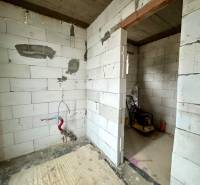 A building in a family house with unfinished walls and electrical wiring.