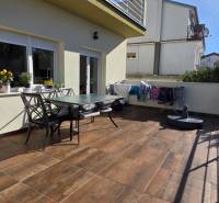 Terrace of a 3-room apartment in Crikvenica, with furniture and a clothes dryer.