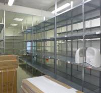 Shelving systems in commercial spaces with sinks and packaged goods.