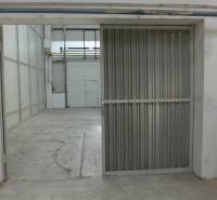 Warehouses and halls with concrete floors and metal doors in the interior.
