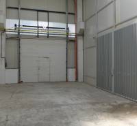 A space with concrete floors and high ceilings in warehouses and halls.