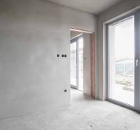 Interior of a family house with sliding doors and unfinished walls.