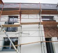Scaffolding around a family house in Nové Zámky, extension and facade renovation.