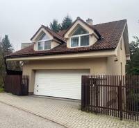 A family house on Mozartova Street in Bratislava - Staré Mesto with a garage and a pitched roof.