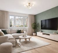 Living room in a 4-room apartment with a comfortable sofa and a wooden decor floor.