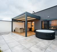 Terrace of a 3-room apartment with a hot tub and rattan furniture, Kožušnícka Street in Trenčín.