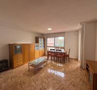 A four-room apartment with rustic furniture and marble flooring.