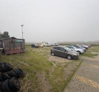 Parking lot on Bratislavská Street in Veľký Biel, used for land - housing.