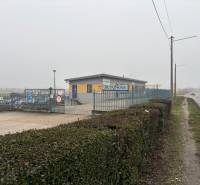 Car wash in the fog on Bratislavská Street, Veľký Biel, Residential land.