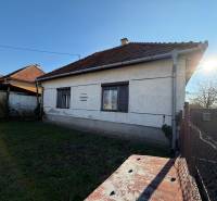 A family house on the main street in Súlovce with a white facade and a gabled roof.