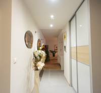 A hallway in a 4-room apartment with decorations and a wardrobe.