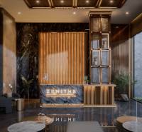 The interior of the entrance hall with a marble wall and a floor with a wooden design. Apartment construction.