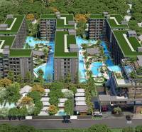 Apartment construction in Pattaya with pools and green roofs, surrounded by nature.