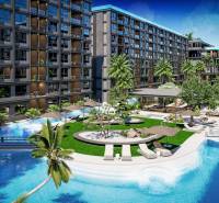 Apartment construction in Pattaya, pools, palm trees, and spacious common areas.
