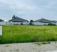 Plots - housing in Hviezdoslavov on Podháj with grassy area and surrounding houses.