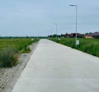 Street Podháj in Hviezdoslavov with residential plots surrounded by houses.