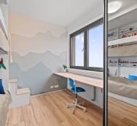 Children's room with a bunk bed, a desk, and a floor with a wooden decor.