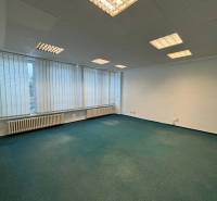 Offices with large windows and carpeted floors available.