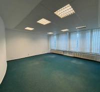 Offices with carpet, fluorescent lighting, and vertical blinds.