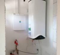 Heating with a boiler and tank in a family house.