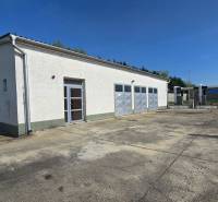 Warehouses and halls in Šaľa with three garage doors and a reinforced adjacent area.