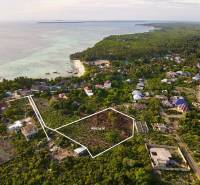 Aerial view of Commercial Land in Kizimkazi, with green areas and coastline.