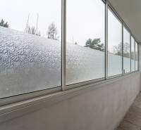 Enclosed loggia with opaque glass in a 3-room apartment, suitable for relaxation.