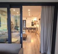 Interior of a family house with a wooden decor floor and comfortable seating.