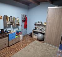 Children's room in a family house with wooden decor and furniture.