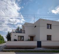 A family house on Trnovecká Street in Trnovec nad Váhom with a clear sky.