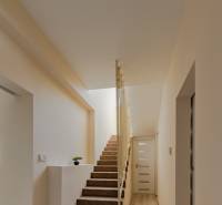 Interior of a family house with a carpeted staircase and a wooden decor floor.