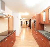 A kitchen in a family house with a wooden decor countertop and floor.