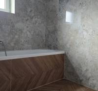A bathroom in a family house with a bathtub, tiles with a stone pattern, and a floor with a wooden decor.