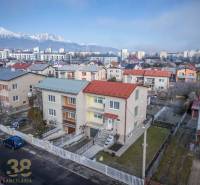 Family houses in Poprad with a view of the Tatras, surrounded by the city panorama.