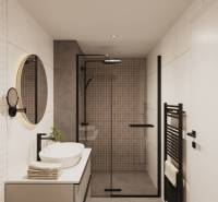 A bathroom in a building with a glass shower enclosure and a white sink.