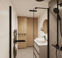 Bathroom with dark shower accessories and wood-patterned flooring.