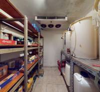 A beer warehouse with shelves and tanks in commercial premises.